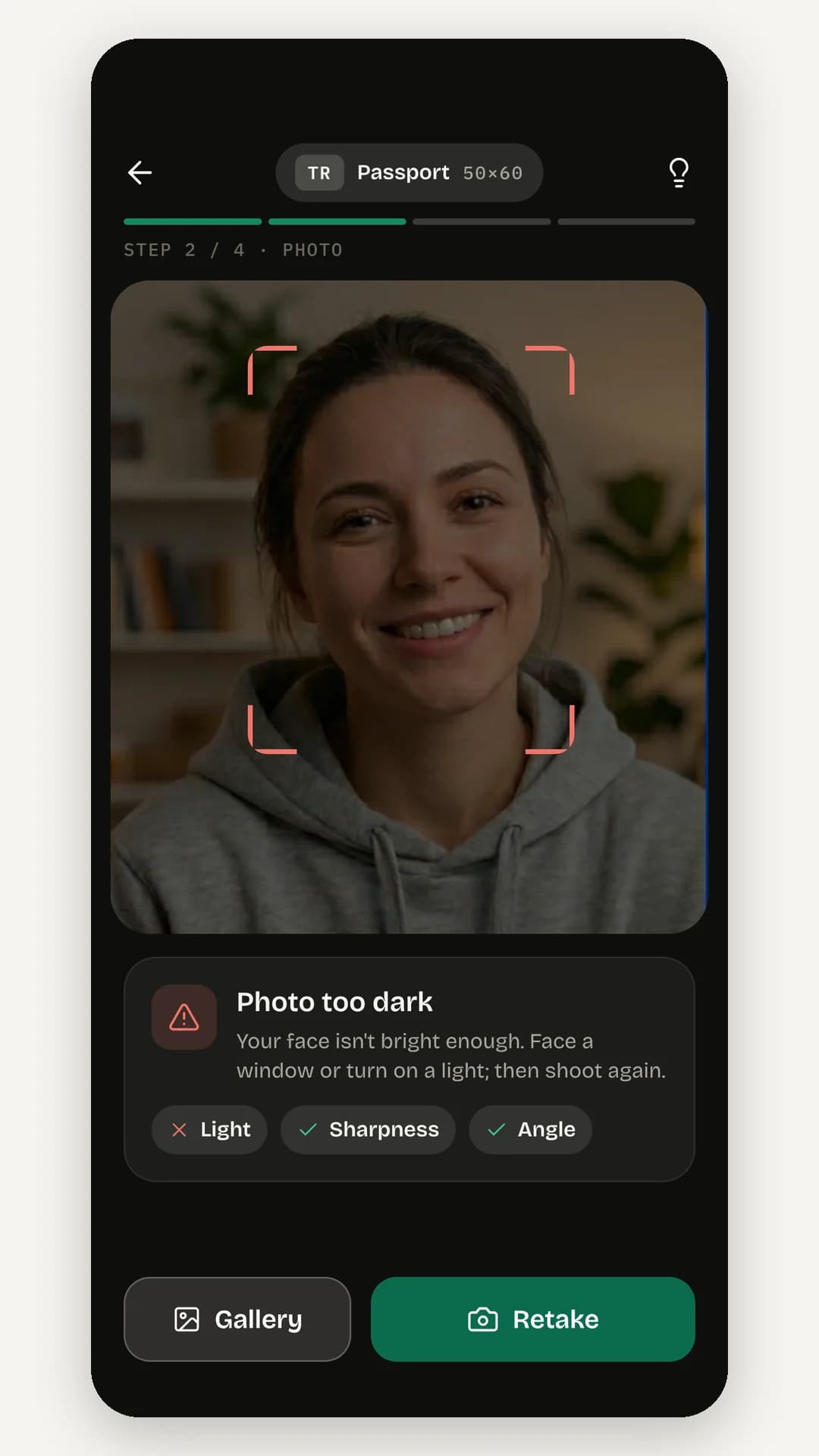 A rejected photo: red viewfinder brackets and a Photo too dark card with Light, Sharpness and Angle checks, plus Gallery and Retake buttons